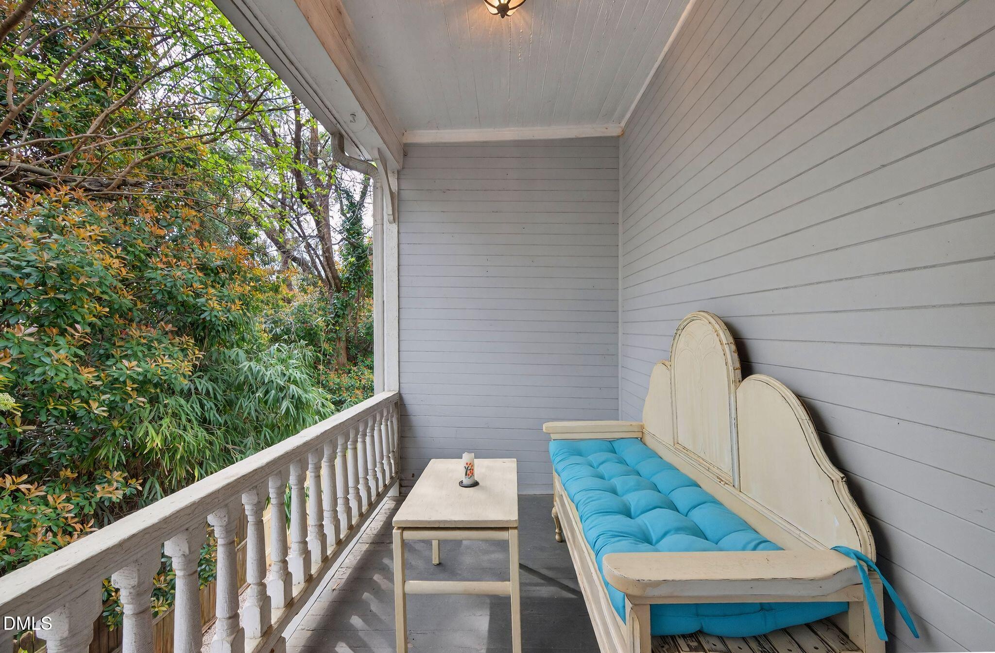 218 Pace Street Raleigh, NC 27604 - Photo 34 of 43 a view of balcony with wooden floor and outdoor seating