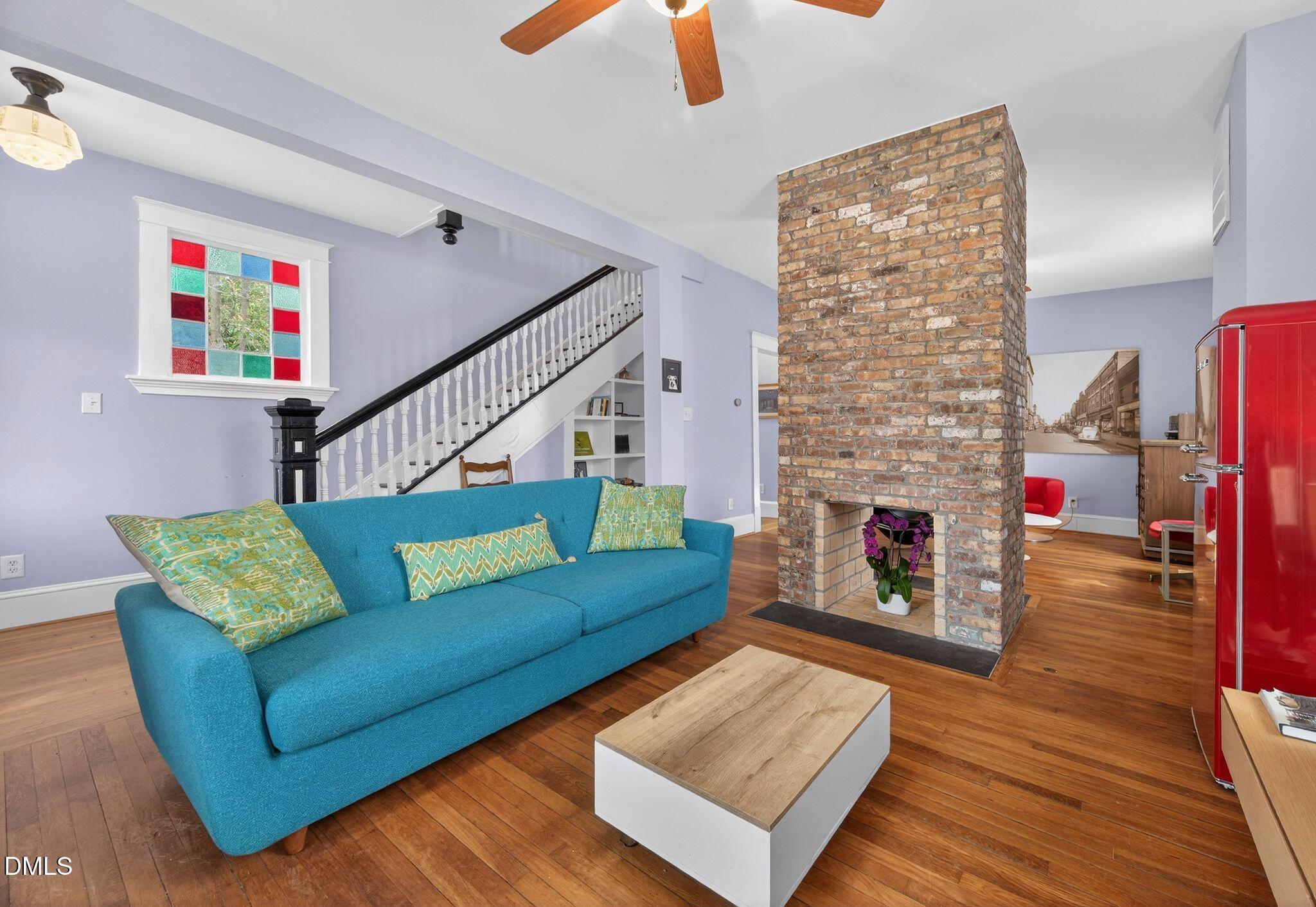 218 Pace Street Raleigh, NC 27604 - Photo 7 of 43 a living room with furniture and a fireplace