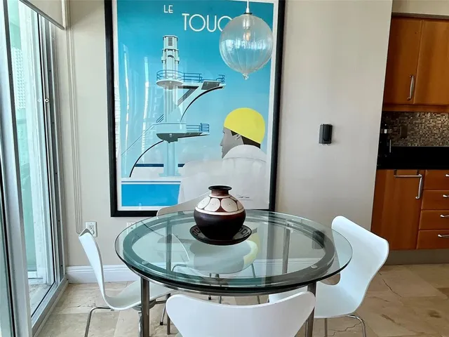 a dining room with table and chairs