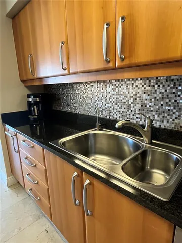 a kitchen with a stove and a microwave