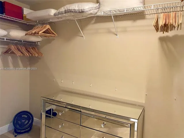 a room with a sink a washer and dryer