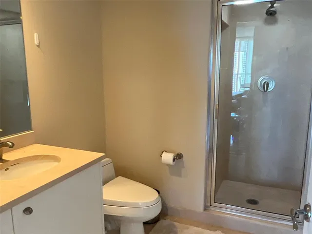 a living room with furniture flowerpot and a rug
