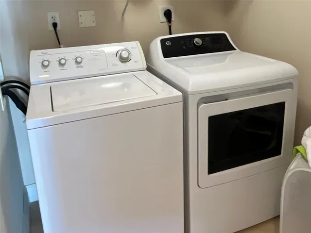 a view of a dining room with furniture and window
