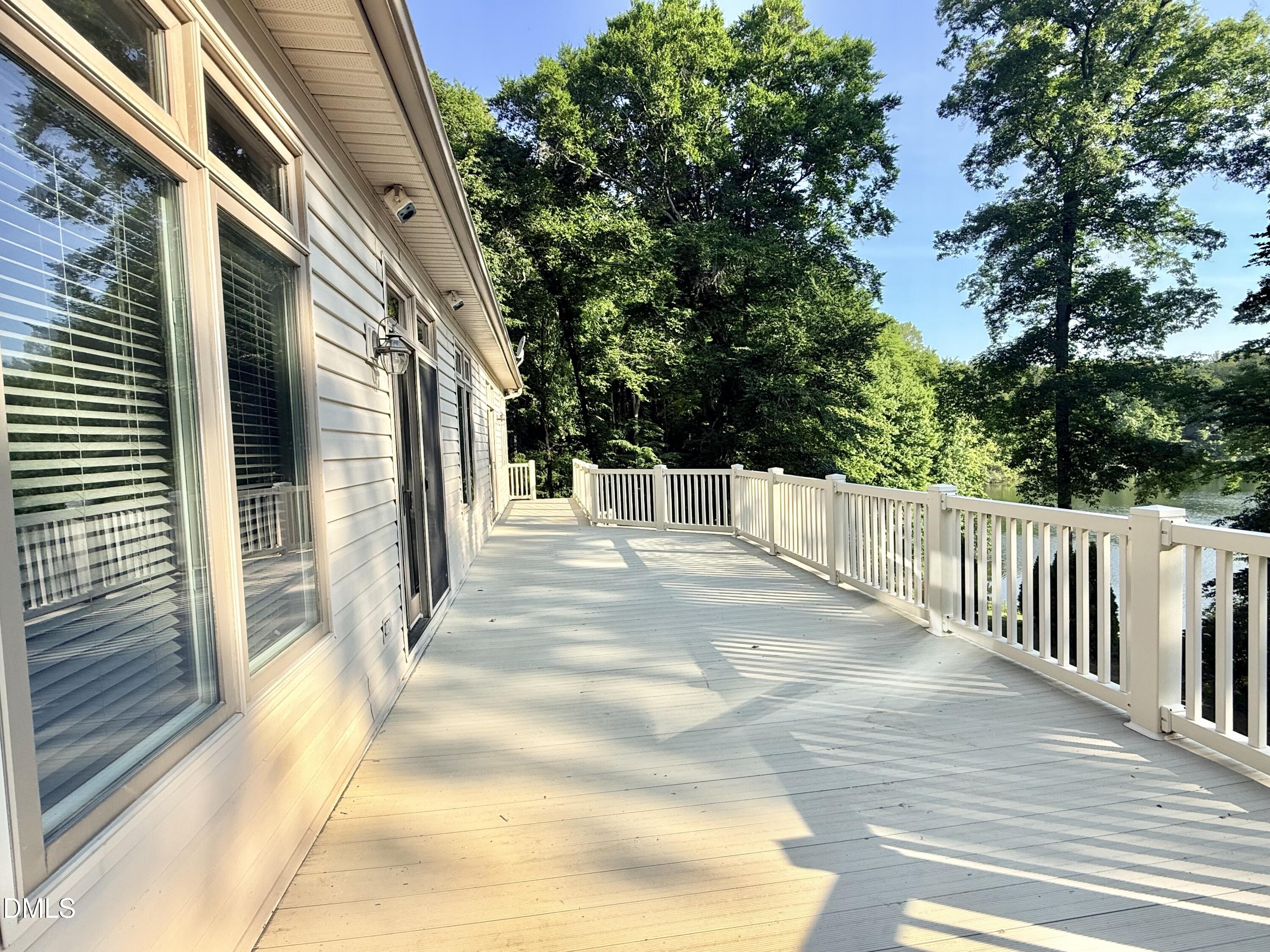 81 Beaver Crossing Road Roxboro, NC 27574 - Photo 14 of 80 a view of a patio with table and chairs and wooden fence