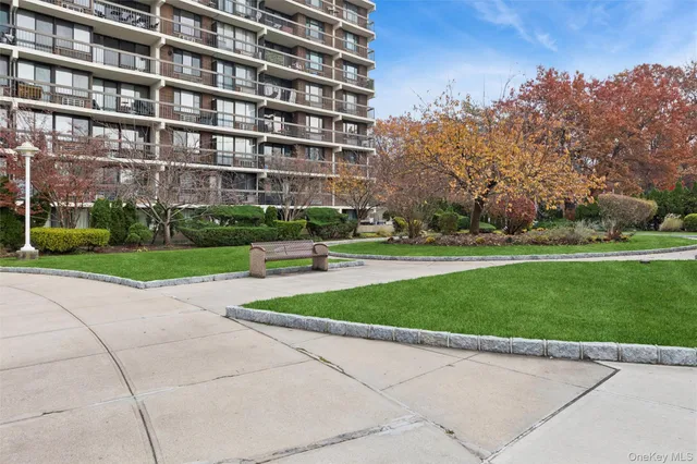 a view of a building with a yard