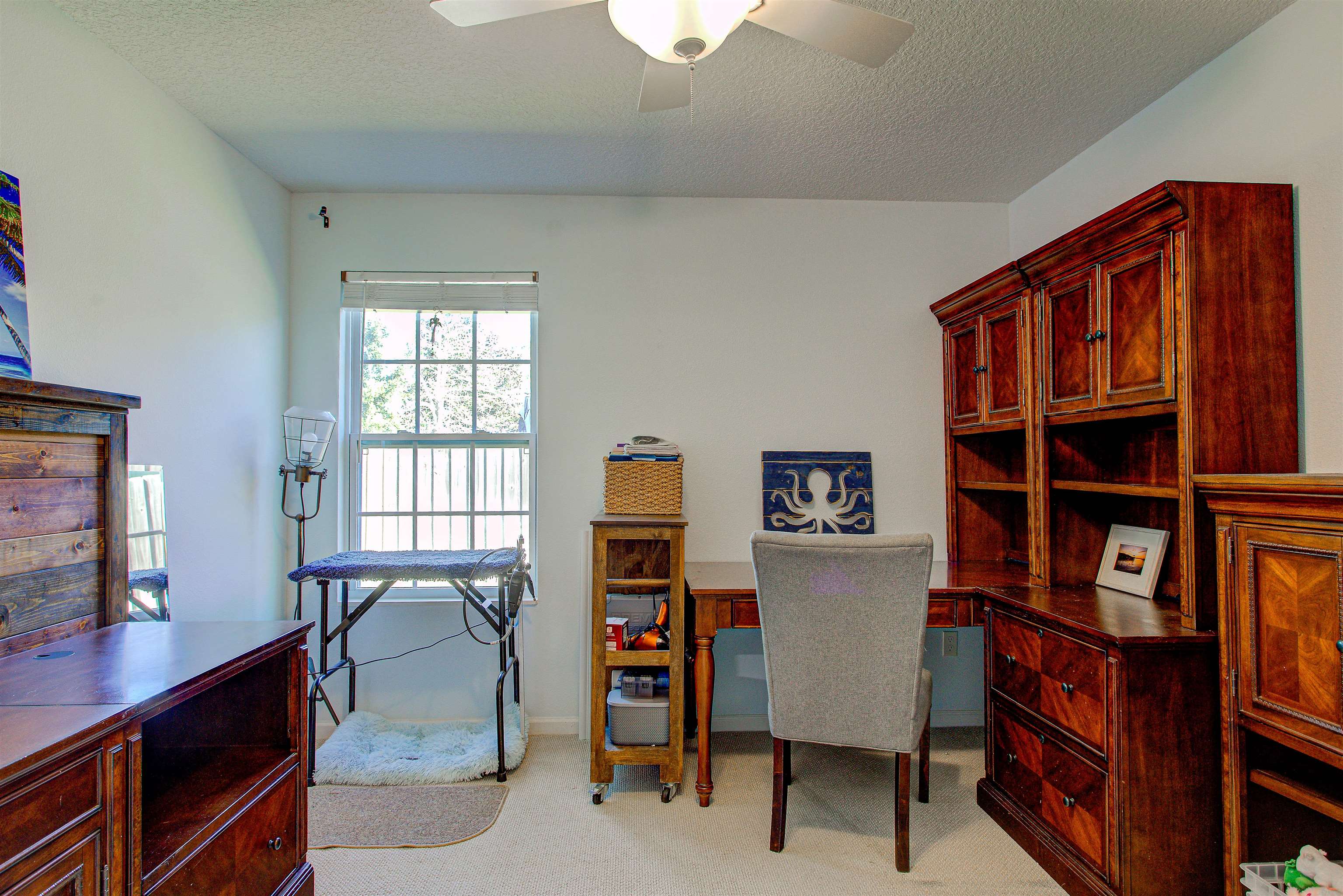 292 North Twin Maple Road St. Augustine, FL 32084 - Photo 36 of 79 a view of a workspace with furniture and a window
