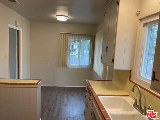 a bathroom with a sink and a large mirror