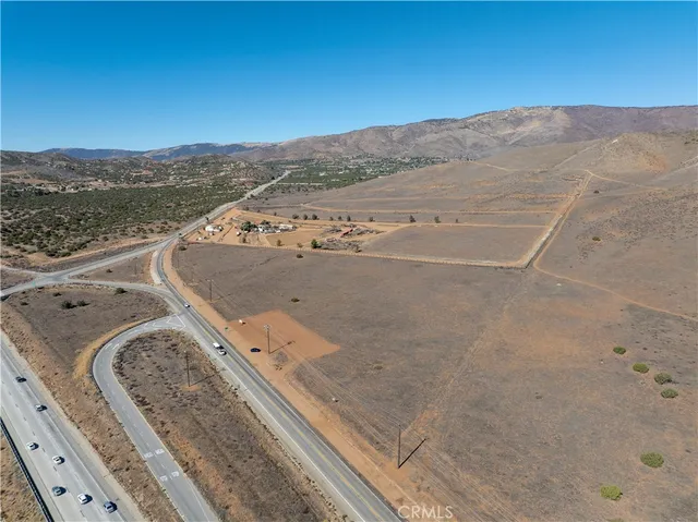 view of a mountain with a mountain in the background