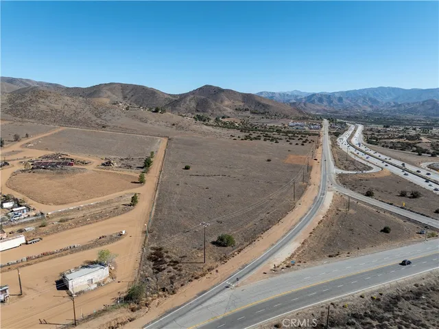 a view of a living room with a white bed