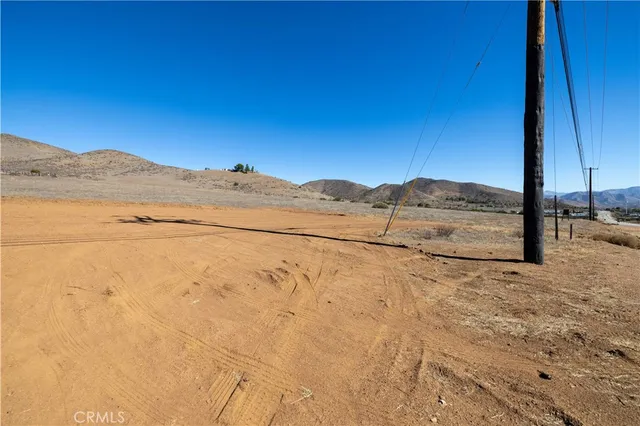 a view of a road with a building in the background