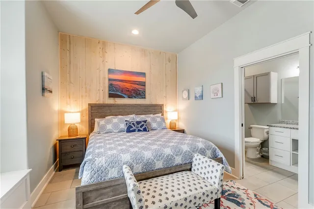 a bedroom with a bed and a view of bathroom