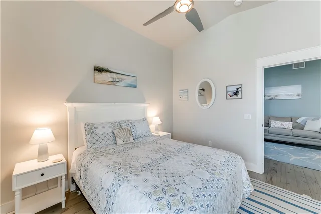 a bedroom with a bed and a lamp