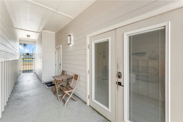 a view of a hallway with seating area