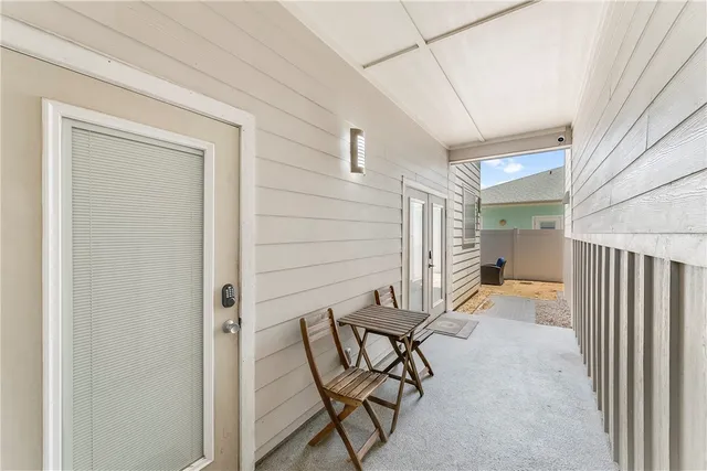 a view of a livingroom with furniture and backyard