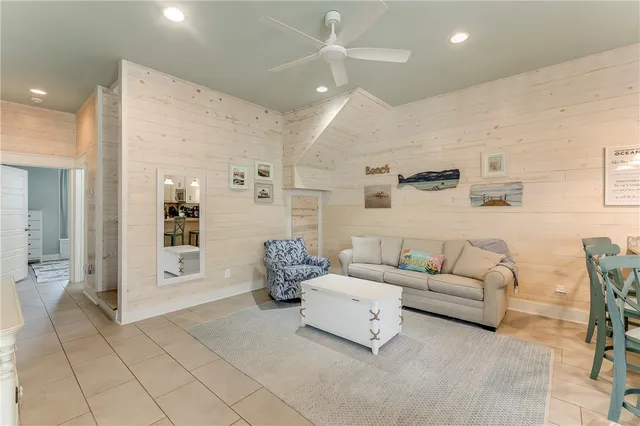 a living room with furniture and white walls