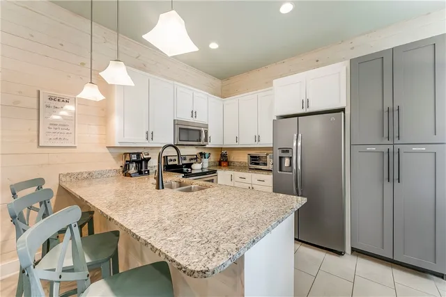 a kitchen with refrigerator and countertop