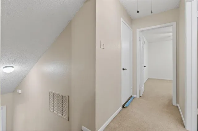 a view of a hallway with closet