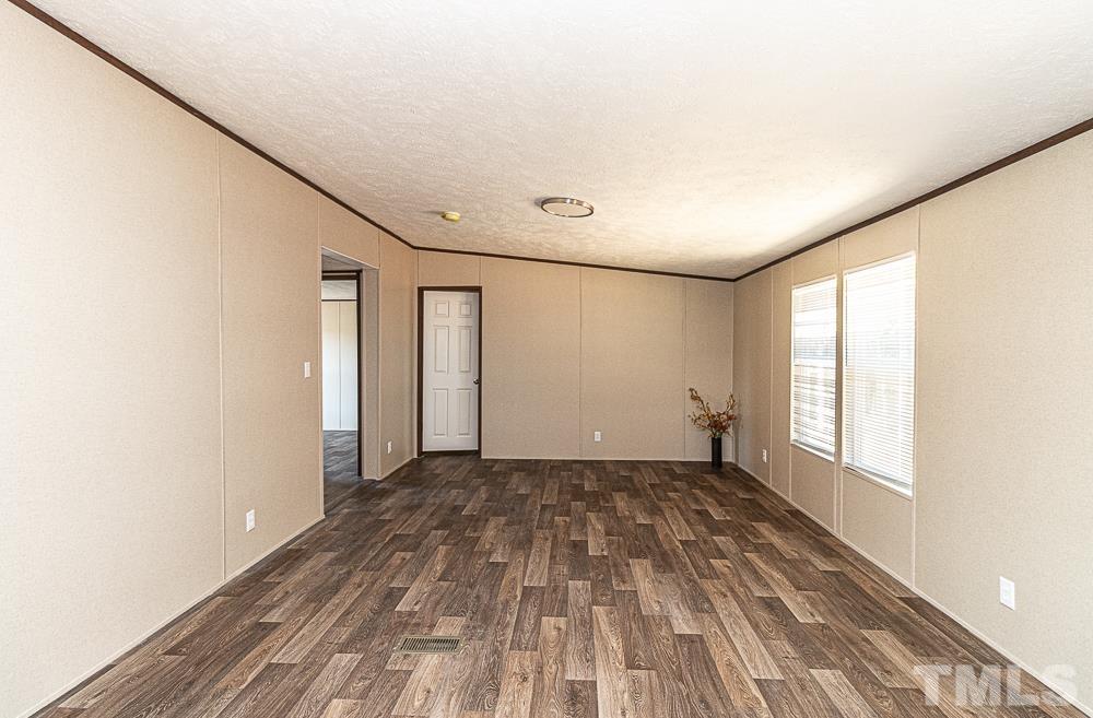 7288 Broad Leaf Dr Spring Spring Hope, NC 27882 - Photo 8 of 19 a view of an empty room with a window