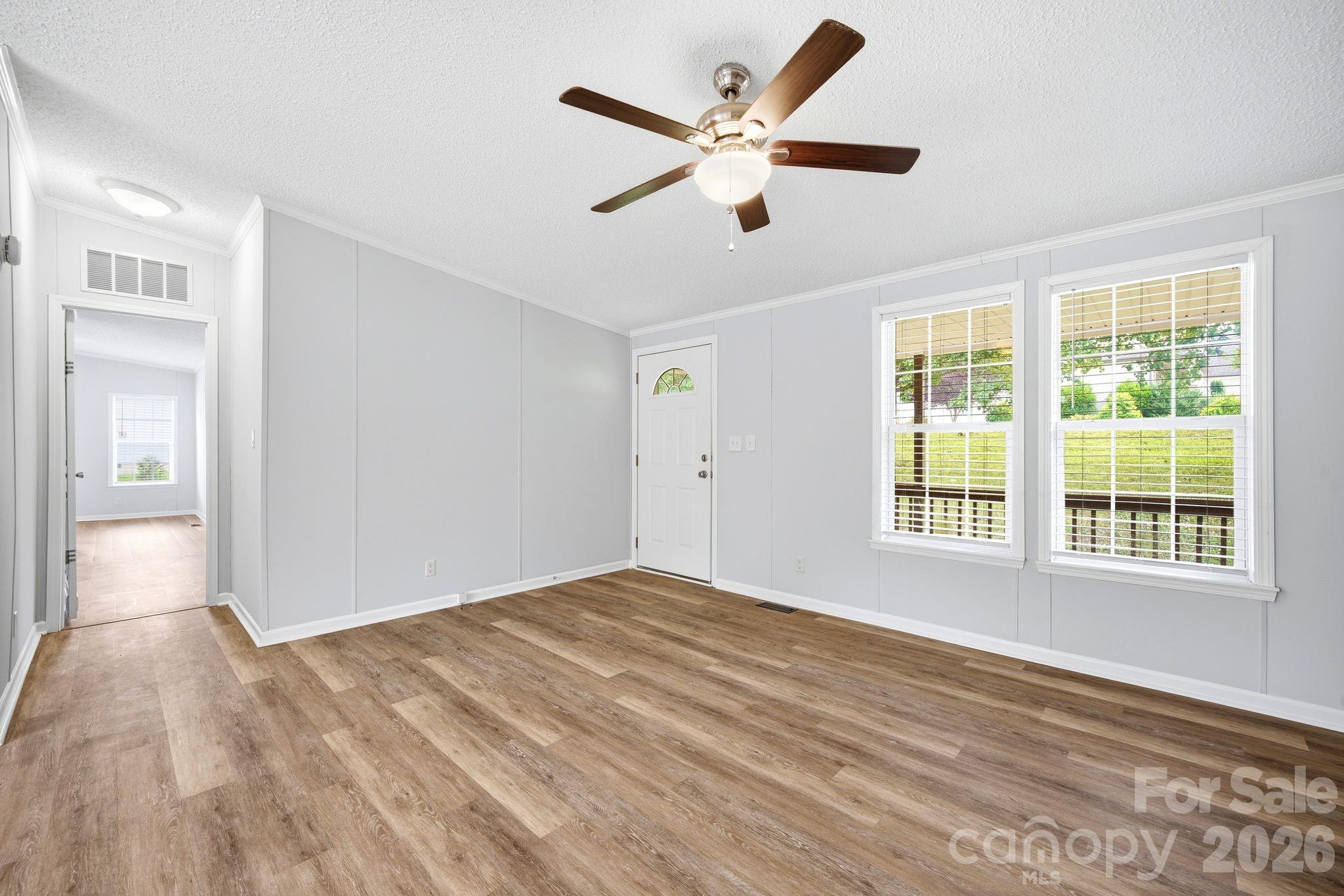 2368 Beth Haven Church Road Denver, NC 28037 - Photo 11 of 42 a view of an empty room with a window and wooden floor