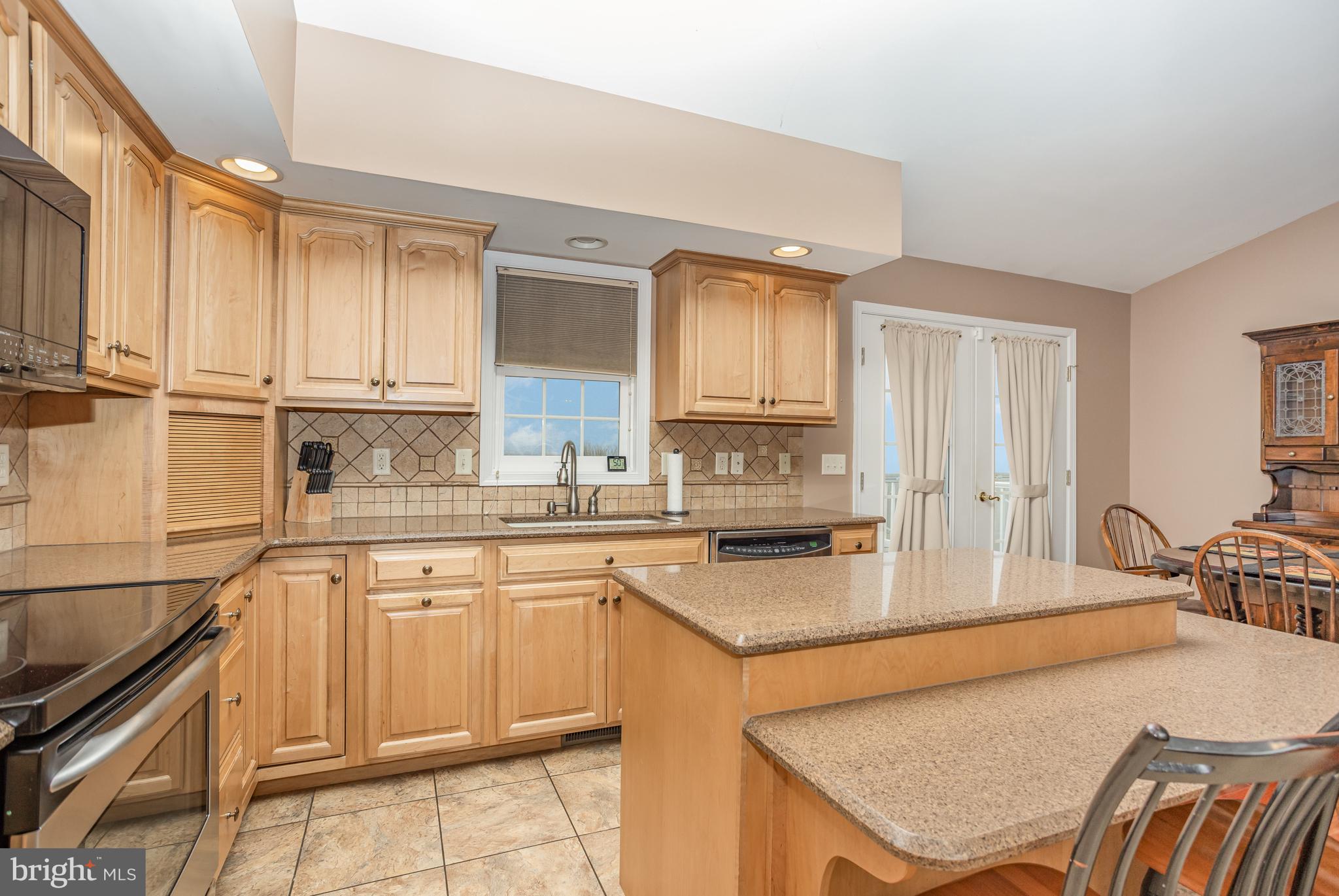 714 Heather Ridge Manheim, PA 17545 - Photo 13 of 33 a kitchen with granite countertop a sink stove and cabinets