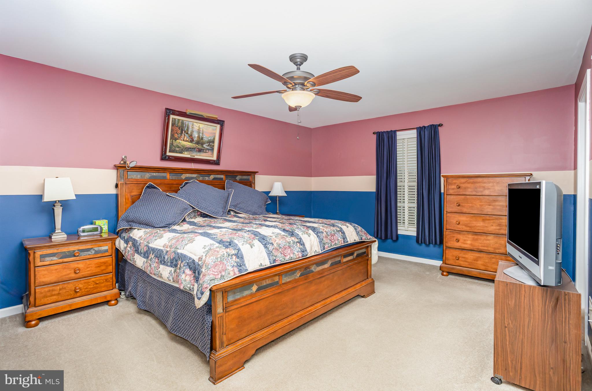714 Heather Ridge Manheim, PA 17545 - Photo 19 of 33 a bed room with a bed and a chandelier