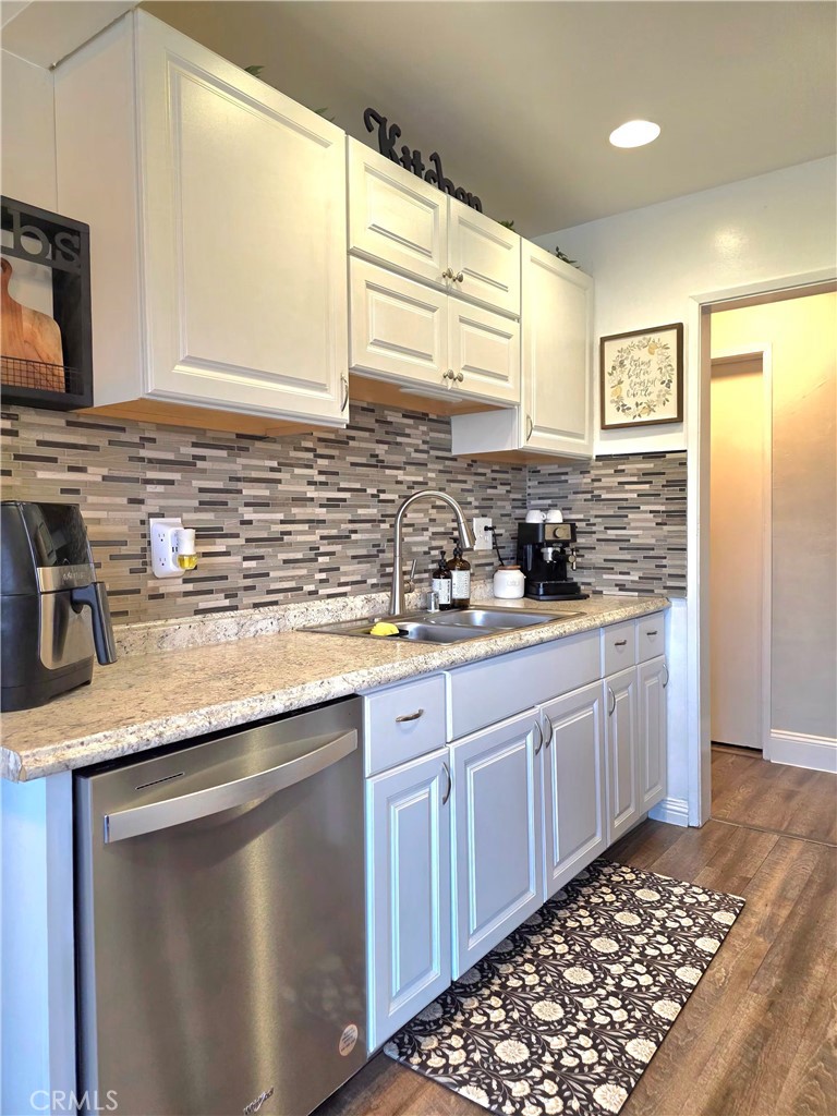 1200 West Lambert Road, Unit 32 La Habra, CA 90631 - Photo 11 of 34 a kitchen with stainless steel appliances granite countertop a sink stove and cabinets