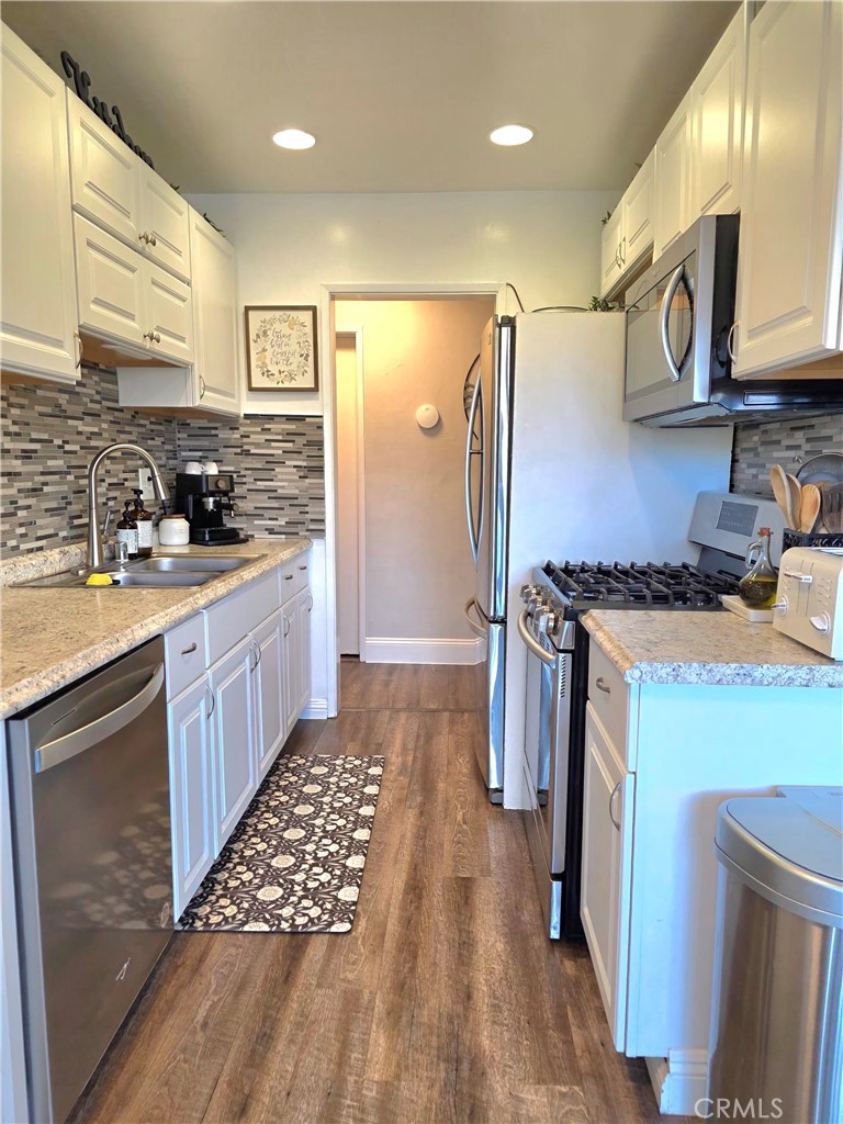 1200 West Lambert Road, Unit 32 La Habra, CA 90631 - Photo 13 of 34 a kitchen with a sink stove and refrigerator