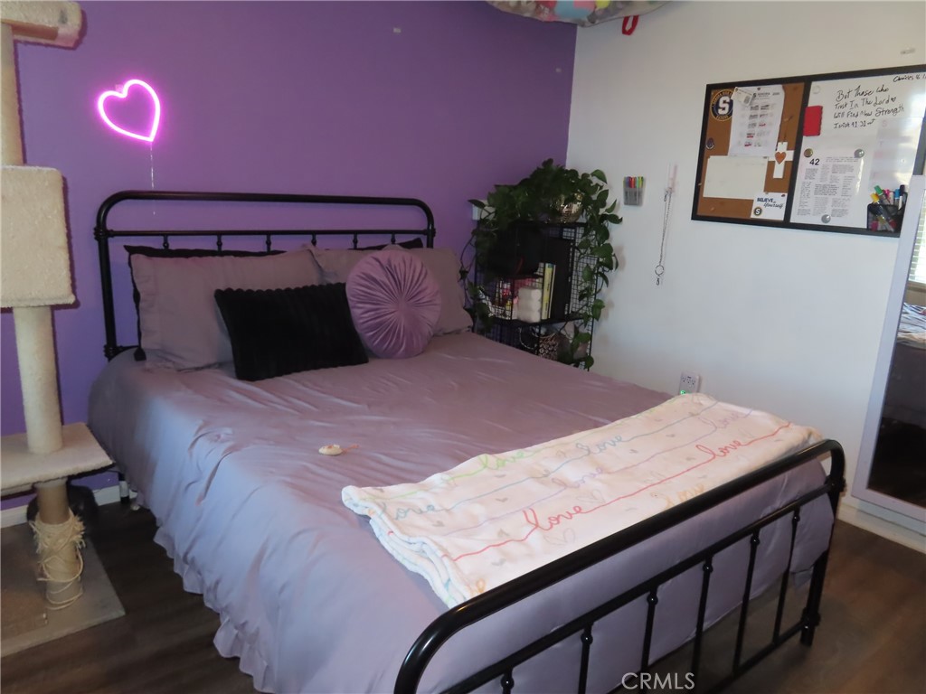 1200 West Lambert Road, Unit 32 La Habra, CA 90631 - Photo 20 of 34 a bed sitting in a bedroom next to a lamp