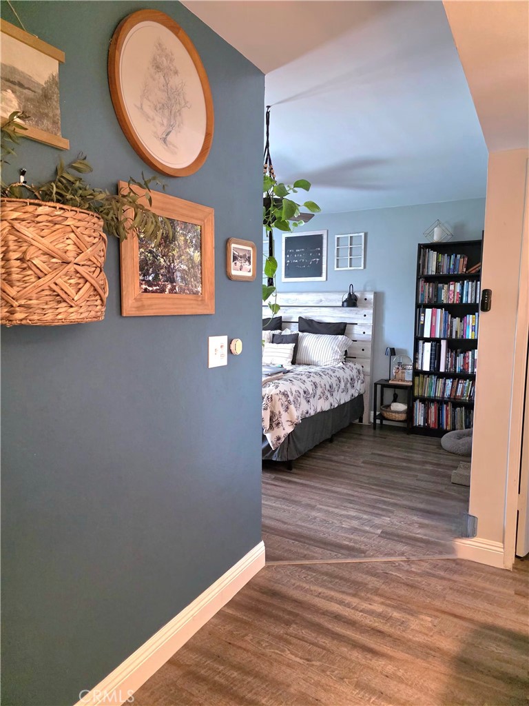 1200 West Lambert Road, Unit 32 La Habra, CA 90631 - Photo 21 of 34 a view of a bedroom with wooden floor & window