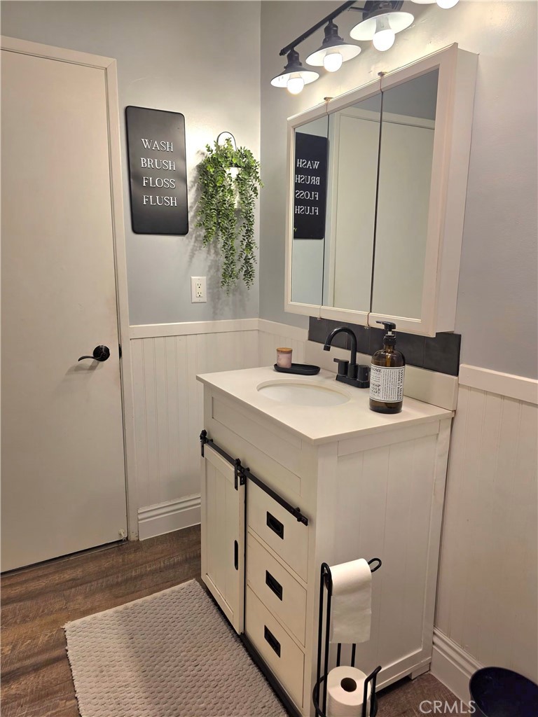 1200 West Lambert Road, Unit 32 La Habra, CA 90631 - Photo 24 of 34 a bathroom with a sink and a mirror