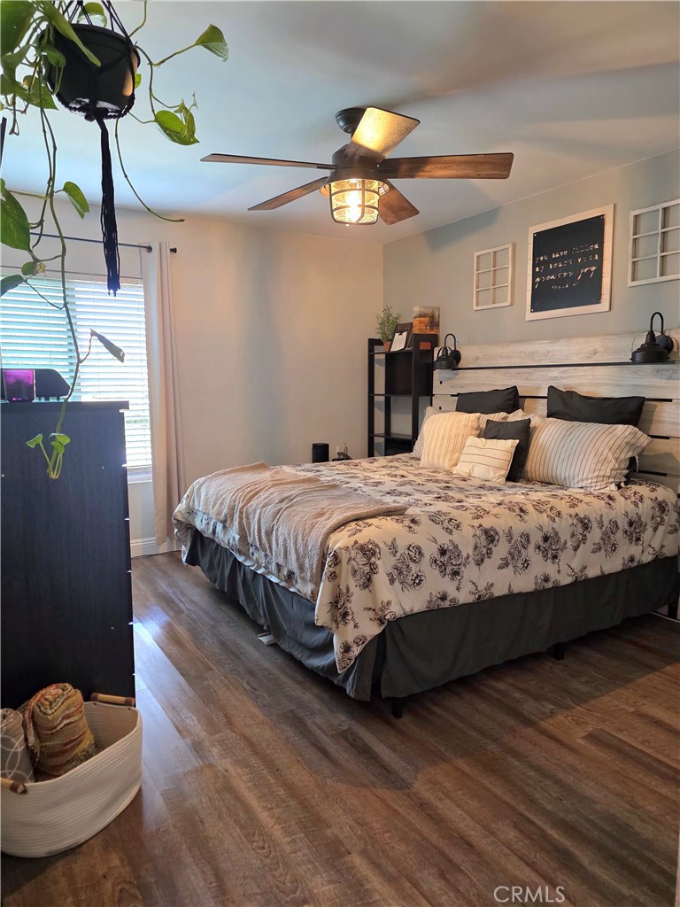 1200 West Lambert Road, Unit 32 La Habra, CA 90631 - Photo 26 of 34 a bedroom with a bed and ceiling fan