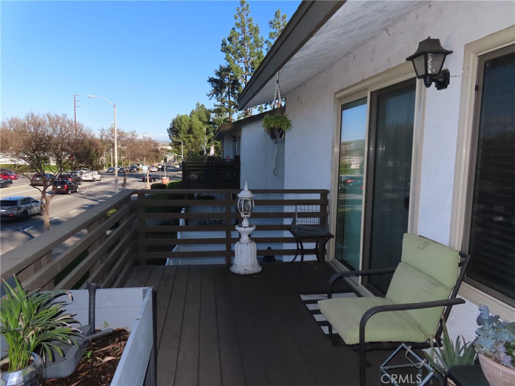 1200 West Lambert Road, Unit 32 La Habra, CA 90631 - Photo 29 of 34 a view of a balcony with chairs and a potted plant