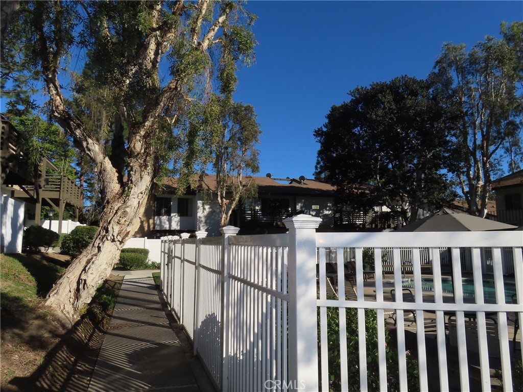 1200 West Lambert Road, Unit 32 La Habra, CA 90631 - Photo 30 of 34 a view of a house with wooden fence