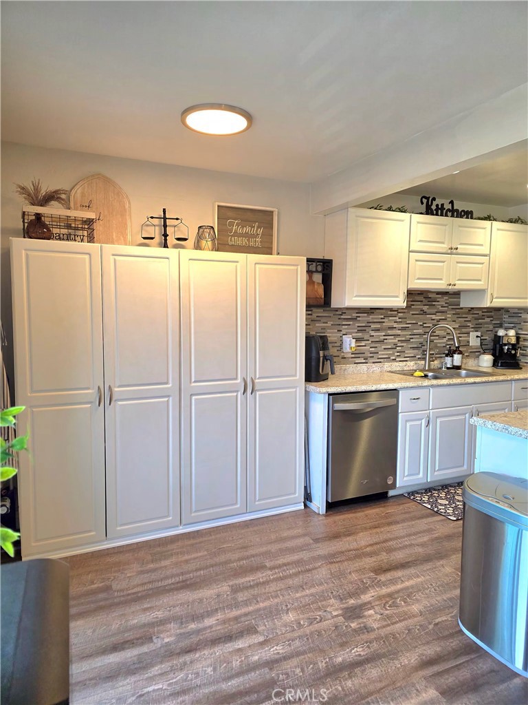1200 West Lambert Road, Unit 32 La Habra, CA 90631 - Photo 9 of 34 a kitchen with granite countertop a refrigerator a sink and a stove