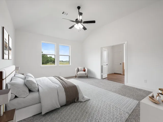 a bedroom with a bed and window
