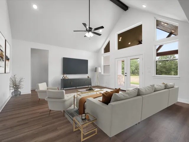 a living room with furniture and a flat screen tv