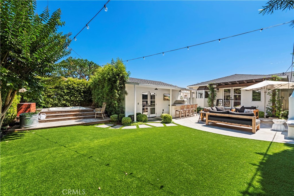 320 Broadway Costa Mesa, CA 92627 - Photo 21 of 25 a view of a house with backyard porch and sitting area