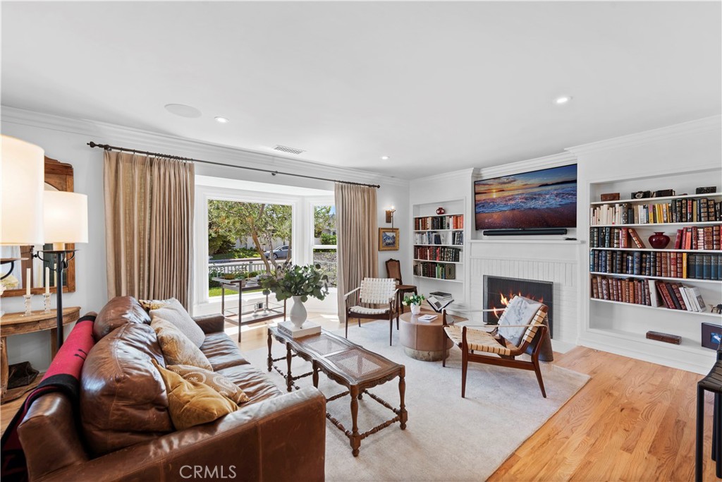 320 Broadway Costa Mesa, CA 92627 - Photo 3 of 25 a living room with furniture fireplace and a large window