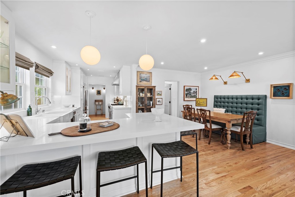 320 Broadway Costa Mesa, CA 92627 - Photo 4 of 25 a view of a dining room with furniture and wooden floor