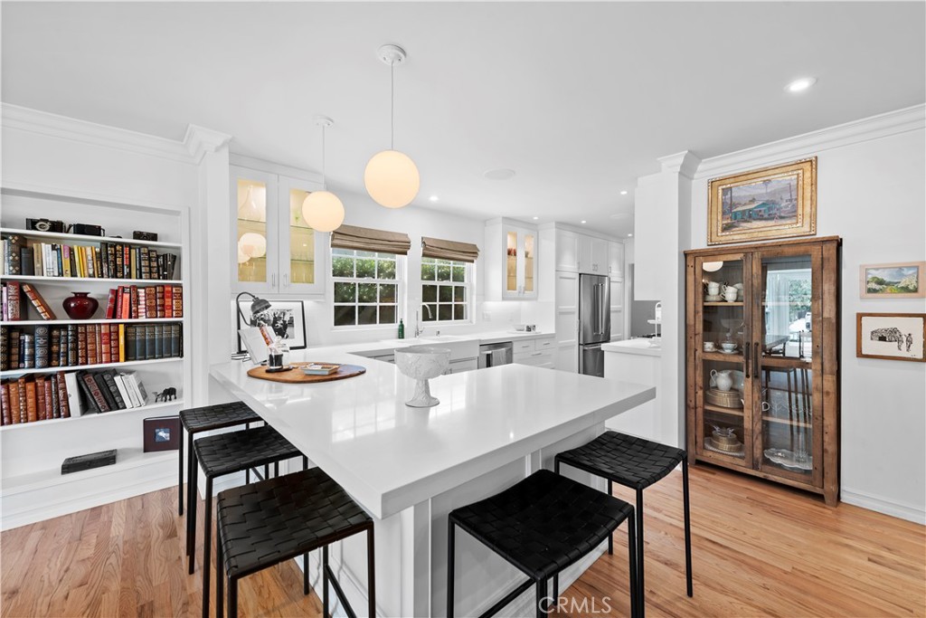 320 Broadway Costa Mesa, CA 92627 - Photo 5 of 25 a view of a dining room with furniture and wooden floor