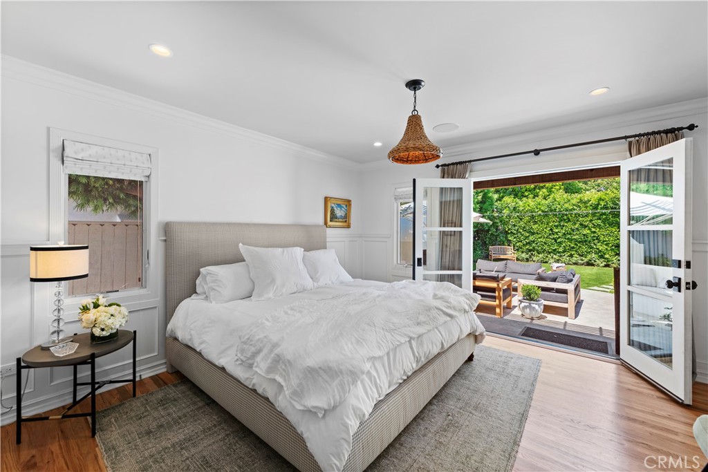 320 Broadway Costa Mesa, CA 92627 - Photo 9 of 25 a bedroom with a bed and a large window