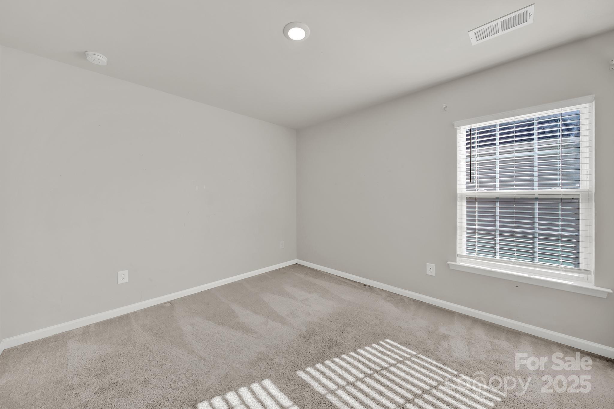 7721 Sea Turtle Way Lancaster, SC 29720 - Photo 24 of 46 a view of an empty room with a window