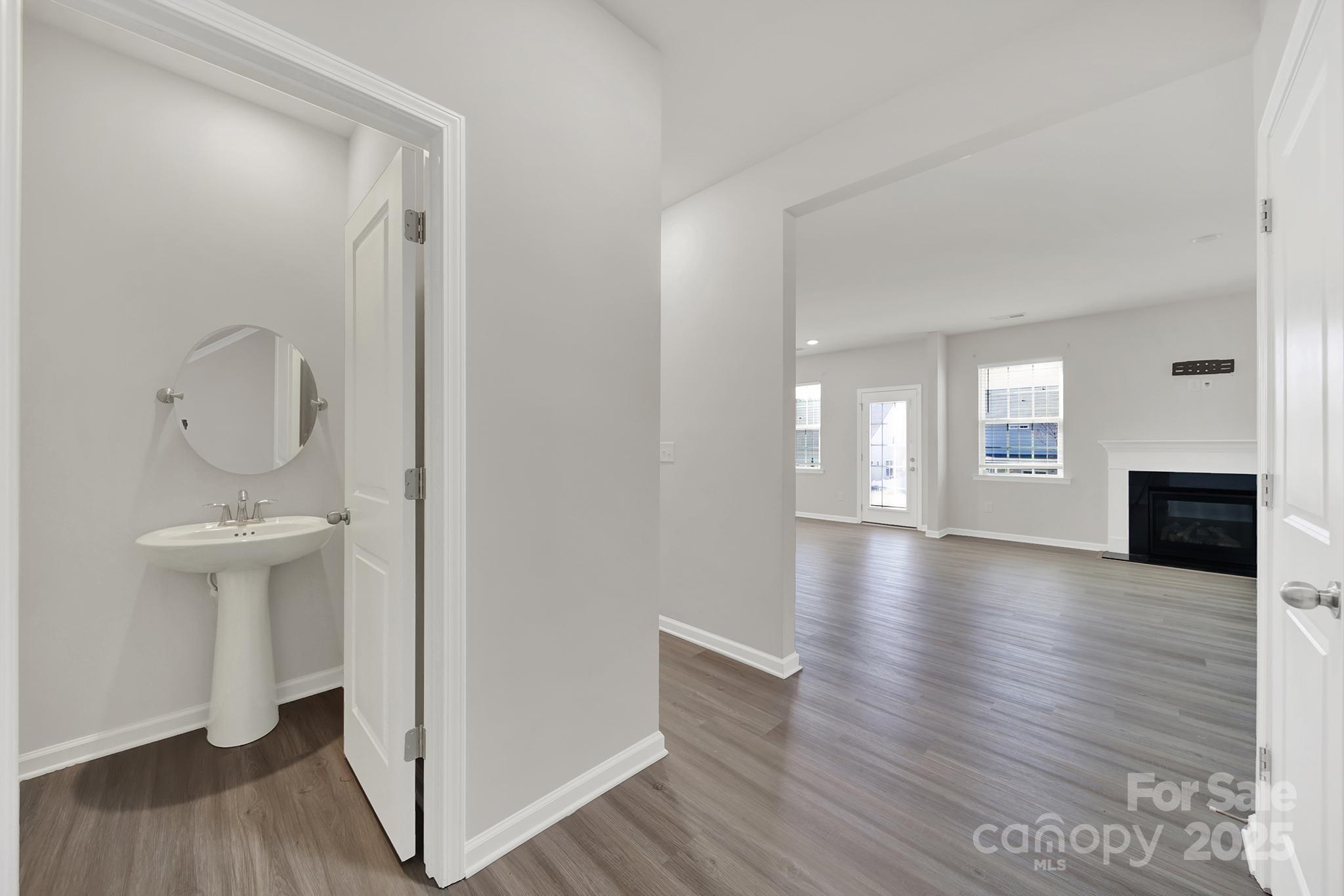 7721 Sea Turtle Way Lancaster, SC 29720 - Photo 3 of 46 a view of livingroom with hardwood floor and a ceiling fan