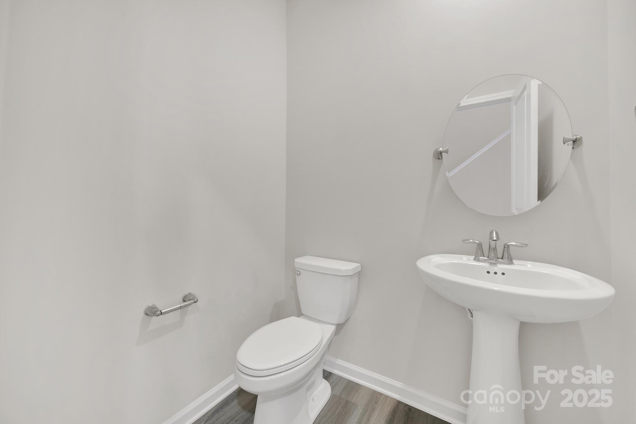 7721 Sea Turtle Way Lancaster, SC 29720 - Photo 5 of 46 a bathroom with a sink a toilet and mirror