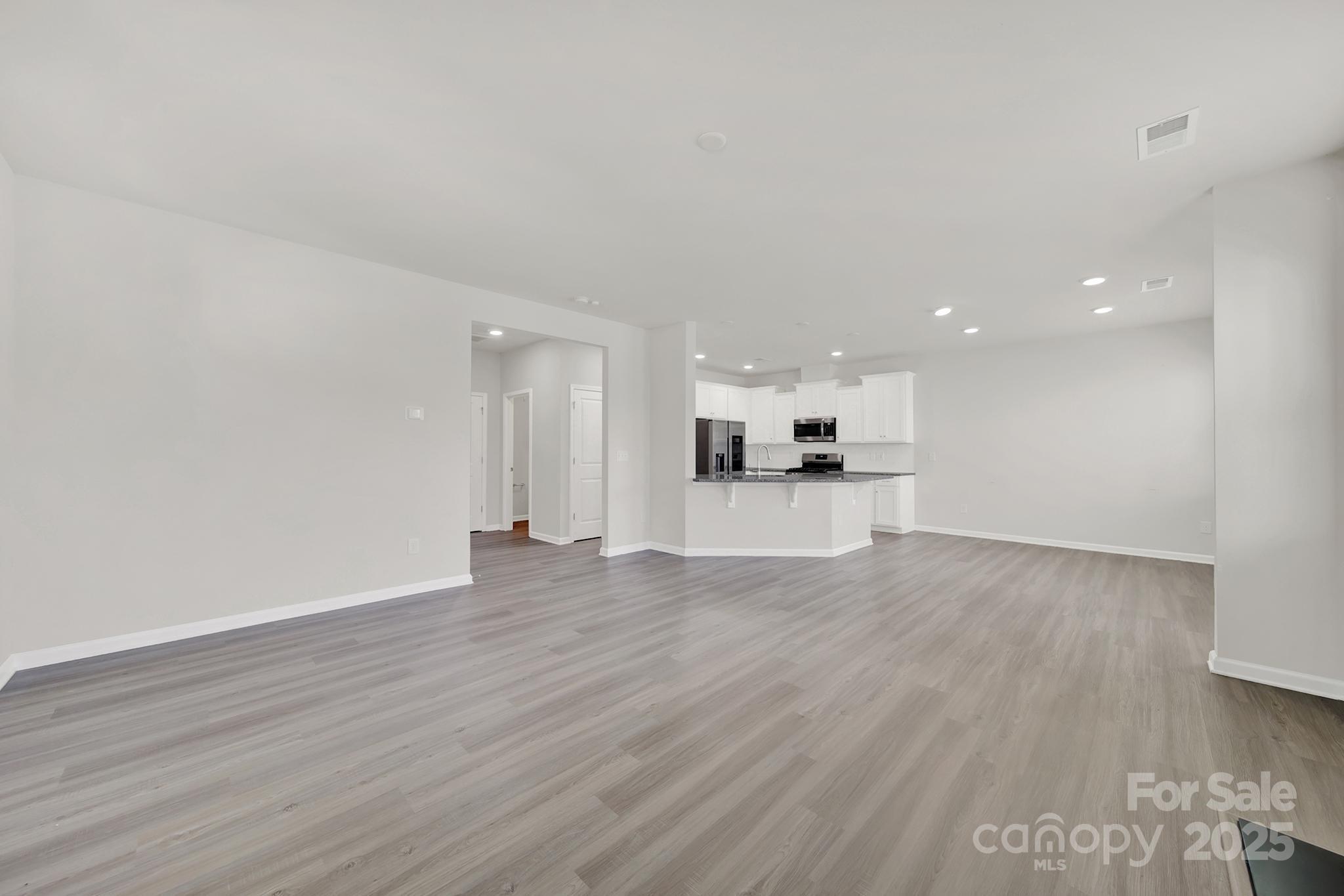 7721 Sea Turtle Way Lancaster, SC 29720 - Photo 9 of 46 a view of large kitchen with wooden floor and outdoor space