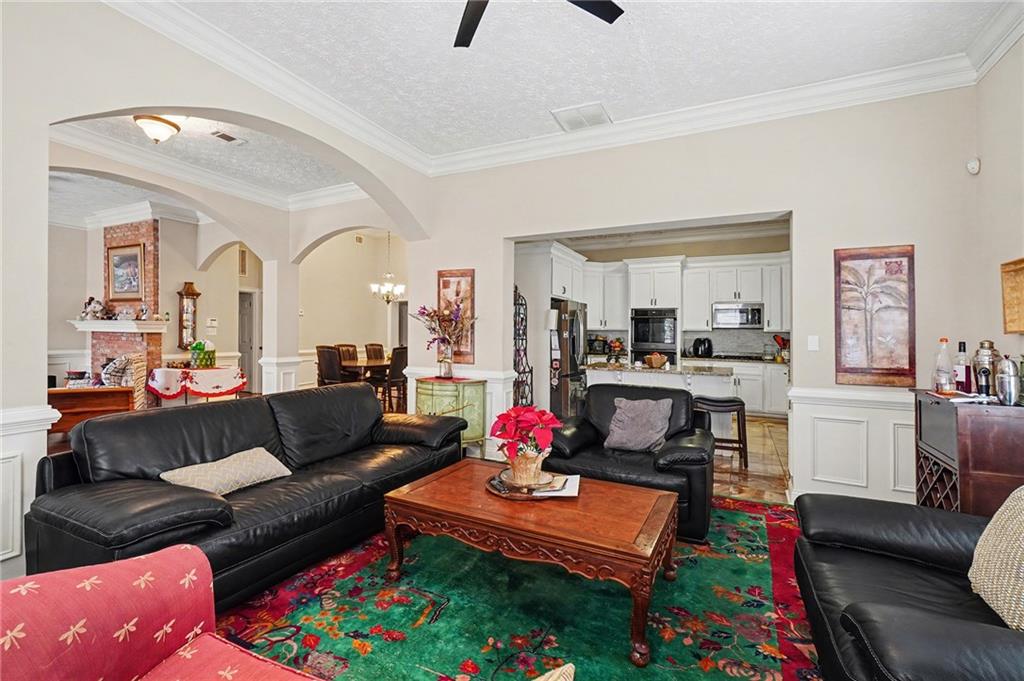 5026 Campbellton Road Southwest Atlanta, GA 30331 - Photo 12 of 39 a living room with furniture and a dining table