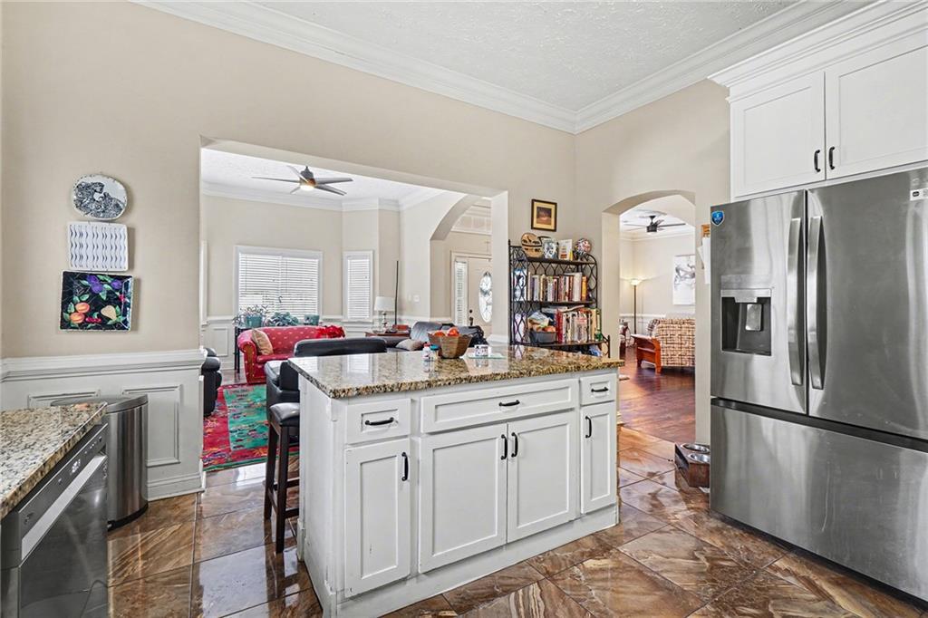 5026 Campbellton Road Southwest Atlanta, GA 30331 - Photo 15 of 39 a kitchen with stainless steel appliances a sink cabinets and a refrigerator