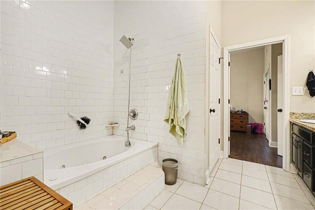 5026 Campbellton Road Southwest Atlanta, GA 30331 - Photo 24 of 39 a bathroom with a bathtub and a shower