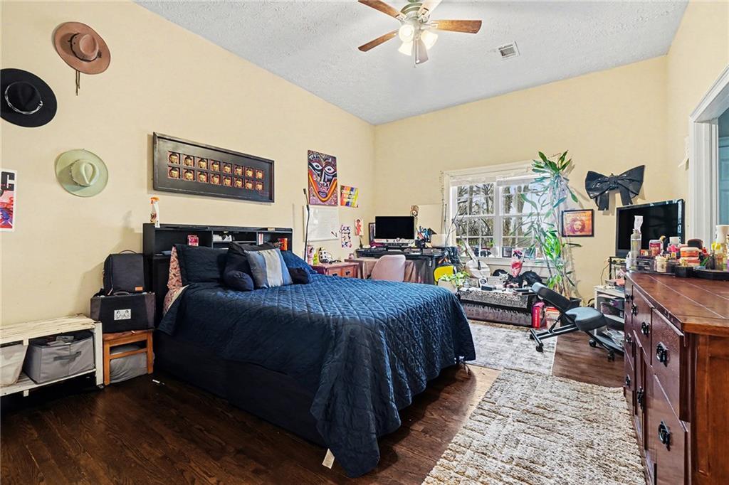 5026 Campbellton Road Southwest Atlanta, GA 30331 - Photo 25 of 39 a bed room with a bed window and a chair