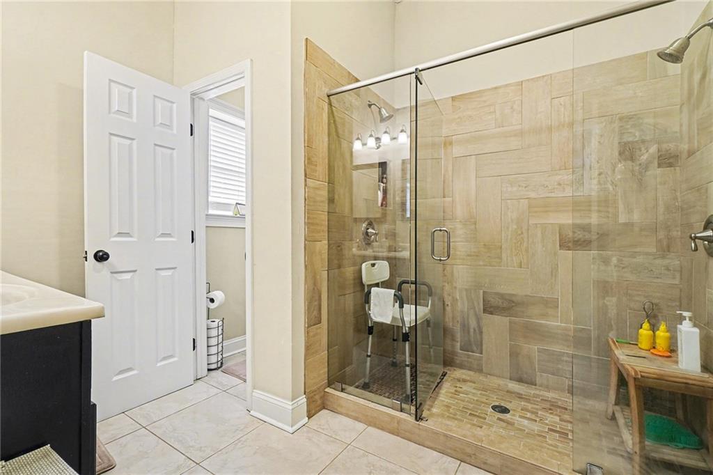 5026 Campbellton Road Southwest Atlanta, GA 30331 - Photo 27 of 39 a bathroom with a shower and a sink